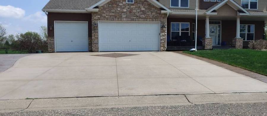 Before: faded, uneven concrete driveway